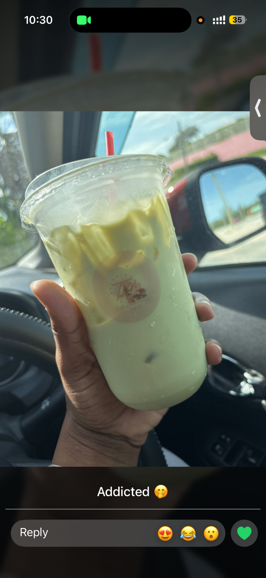 Iced matcha latte in the car